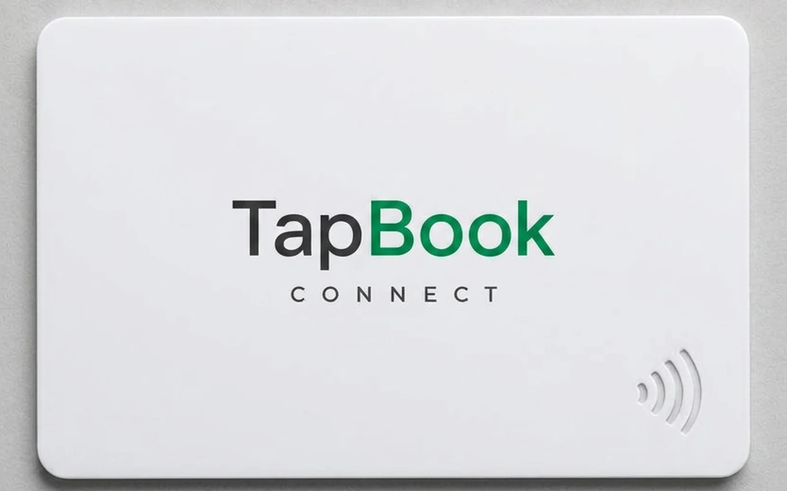 A matte white TapBook Connect NFC card with the wordmark printed on the front